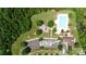 An aerial view of the Seven Oaks Clubhouse and pool, with a playground and parking lot in Charlotte, NC at 10211 Snowbell Ct, Charlotte, NC 28215