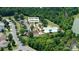 Aerial view of the Seven Oaks Clubhouse, pool and playground with ample parking in a suburban Charlotte neighborhood at 10211 Snowbell Ct, Charlotte, NC 28215