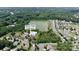An aerial view of the Seven Oaks Clubhouse, pool, and lake in a residential neighborhood in Charlotte, NC at 10211 Snowbell Ct, Charlotte, NC 28215
