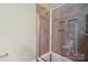 A tiled walk-in shower inside the bathroom at 10211 Snowbell Ct, Charlotte, NC 28215