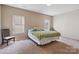 Cozy bedroom features two windows for natural light at 10211 Snowbell Ct, Charlotte, NC 28215