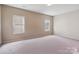 Empty bedroom with natural light, ready for your personal touch at 10211 Snowbell Ct, Charlotte, NC 28215