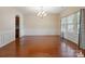 Formal dining room featuring wainscoting, chandelier, and ample natural light at 10211 Snowbell Ct, Charlotte, NC 28215