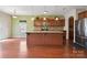 Kitchen with a large island, stainless steel appliances, and hardwood floors at 10211 Snowbell Ct, Charlotte, NC 28215