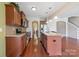 Well-lit kitchen featuring granite countertops, stainless steel appliances, and a functional center island at 10211 Snowbell Ct, Charlotte, NC 28215