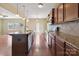 Modern kitchen with granite countertops, stainless steel appliances, and plenty of storage space at 10211 Snowbell Ct, Charlotte, NC 28215