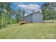 Beautiful backyard view featuring a large deck and newly installed siding at 1025 Harrogate Dr, Bessemer City, NC 28016