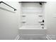 Bathroom featuring white bathtub, shower combo with dark fixtures and neutral walls at 1025 Harrogate Dr, Bessemer City, NC 28016