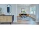 Elegant dining room features a modern chandelier, stylish sideboard, and comfortable seating, perfect for entertaining and Gathering meals at 1025 Harrogate Dr, Bessemer City, NC 28016