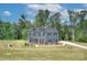 Two-story home featuring a covered front porch and a well-manicured lawn at 1025 Harrogate Dr, Bessemer City, NC 28016