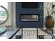 Close-up of a sleek, modern fireplace integrated into a stylish accent wall, enhanced by elegant decor and sophisticated design at 1025 Harrogate Dr, Bessemer City, NC 28016
