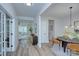 Open foyer with wood-look floors, modern light fixture, and decorative accents at 1025 Harrogate Dr, Bessemer City, NC 28016
