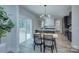 Bright kitchen features a large island, modern cabinetry, and a seamless flow to the outdoor deck, perfect for entertaining at 1025 Harrogate Dr, Bessemer City, NC 28016