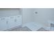 Laundry room with white cabinets, gold hardware, utility sink and washer/dryer hookups at 1025 Harrogate Dr, Bessemer City, NC 28016