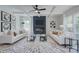 Bright living room features a modern fireplace, stylish decor, and coffered ceilings, creating a welcoming and sophisticated space at 1025 Harrogate Dr, Bessemer City, NC 28016