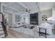 Elegant living room boasts coffered ceilings, a cozy fireplace, and modern furnishings, perfect for relaxation and entertaining guests at 1025 Harrogate Dr, Bessemer City, NC 28016