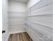 Walk-in pantry with metal shelving for organized storage at 1025 Harrogate Dr, Bessemer City, NC 28016