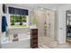 Luxurious bathroom showcasing a soaking tub, glass enclosed shower, and modern fixtures at 107 Hornbeam Ln, Mooresville, NC 28117
