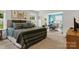 Primary bedroom boasts natural lighting and opens to an adjacent workspace at 107 Hornbeam Ln, Mooresville, NC 28117