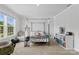 Cozy bedroom with a four-poster bed, carpet flooring, and natural light at 107 Hornbeam Ln, Mooresville, NC 28117