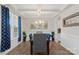 Dining room featuring coffered ceiling, wainscoting, and ample natural light at 107 Hornbeam Ln, Mooresville, NC 28117