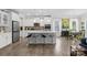 Spacious kitchen with a central island, bar stool seating, and modern appliances at 107 Hornbeam Ln, Mooresville, NC 28117