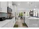 Modern kitchen featuring white cabinets, stainless steel appliances, and open layout at 107 Hornbeam Ln, Mooresville, NC 28117