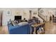 Open living area with hardwood floors, neutral paint, and comfortable blue couches at 107 Hornbeam Ln, Mooresville, NC 28117