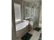 Modern bathroom with freestanding tub, gold fixtures, and frameless glass shower at 10826 Claude Freeman Dr, Charlotte, NC 28262
