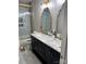 Bathroom showcasing double sink vanity with granite counters, and marble tiled shower at 10826 Claude Freeman Dr, Charlotte, NC 28262