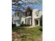 Charming two-story home featuring a manicured lawn, attached two car garage and traditional architectural design at 10826 Claude Freeman Dr, Charlotte, NC 28262