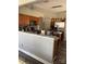 Open kitchen featuring stainless appliances, granite countertops, wooden cabinets and stylish pendant lighting at 10826 Claude Freeman Dr, Charlotte, NC 28262