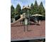 A colorful playground featuring slides, climbing structures, and soft ground cover at 10826 Claude Freeman Dr, Charlotte, NC 28262