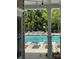Beautiful pool area with lounge chairs and lush greenery seen through the doorway at 10826 Claude Freeman Dr, Charlotte, NC 28262