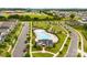Community pool area featuring a pool, playground, and lush green spaces at 11518 Solstice Way, Huntersville, NC 28078