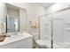 Bathroom featuring a walk-in shower with glass door, ample vanity space, and neutral colors at 11518 Solstice Way, Huntersville, NC 28078