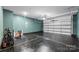 Spacious garage with sealed floor, garage door, and room for parking or projects at 11518 Solstice Way, Huntersville, NC 28078