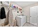 Well-equipped laundry room with washer, dryer, shelving and plenty of storage at 11518 Solstice Way, Huntersville, NC 28078