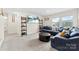 Cozy living room featuring plush seating, shelving, and abundant natural light at 11518 Solstice Way, Huntersville, NC 28078