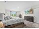 Spacious main bedroom with a bed, dresser, TV, and plenty of natural light at 11518 Solstice Way, Huntersville, NC 28078