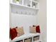 Mudroom area features built-in bench, storage cubbies, and hooks for coats and bags at 11518 Solstice Way, Huntersville, NC 28078