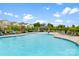 Community pool featuring clear blue water and lounge chairs, perfect for relaxing at 11518 Solstice Way, Huntersville, NC 28078