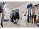 Spacious walk-in closet with ample storage space and attached laundry room at 11518 Solstice Way, Huntersville, NC 28078