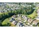 Aerial view of a tree-lined neighborhood and well-manicured lawns at 11718 Preservation Ln, Charlotte, NC 28278