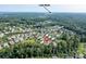Overhead view of a neighborhood with Lake Wylie in the distance at 11718 Preservation Ln, Charlotte, NC 28278