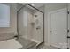 Elegant bathroom with glass-enclosed shower and tiled surround at 11718 Preservation Ln, Charlotte, NC 28278