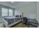 Neat bedroom offering a comfortable bed and workspace, perfect for a student or guest room at 11718 Preservation Ln, Charlotte, NC 28278