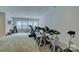 Bright exercise room features modern equipment and large windows for natural light at 11718 Preservation Ln, Charlotte, NC 28278
