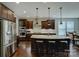 Modern kitchen with stainless steel appliances and a large island at 11718 Preservation Ln, Charlotte, NC 28278