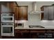 Close-up of kitchen featuring stainless steel appliances and modern cabinetry at 11718 Preservation Ln, Charlotte, NC 28278